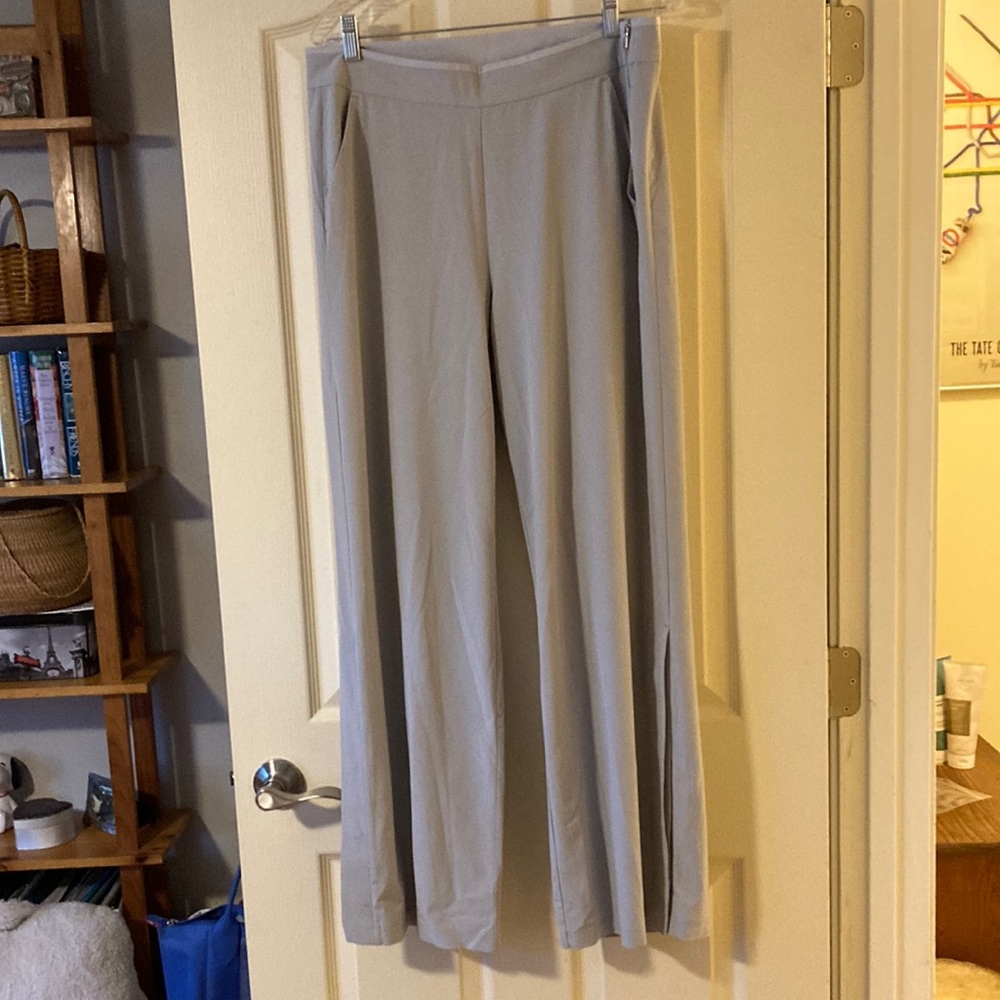 Grey Athleta pants with size zipper and snap opening on legs. Size 12